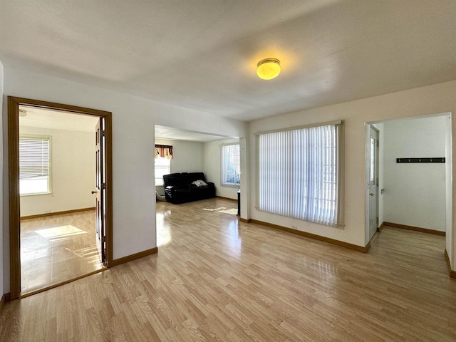 spare room featuring light wood-type flooring