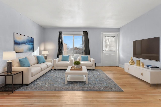 living room with light hardwood / wood-style flooring