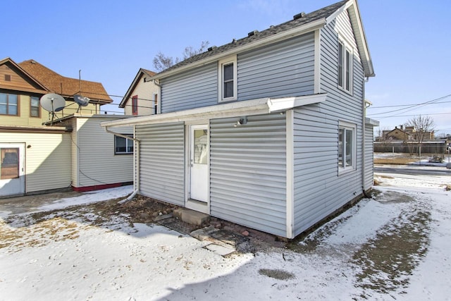 view of snow covered house