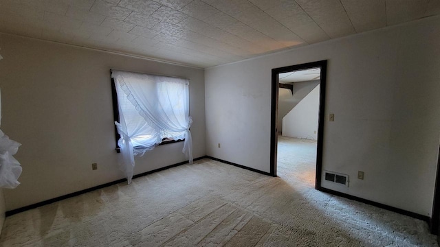 empty room with light colored carpet