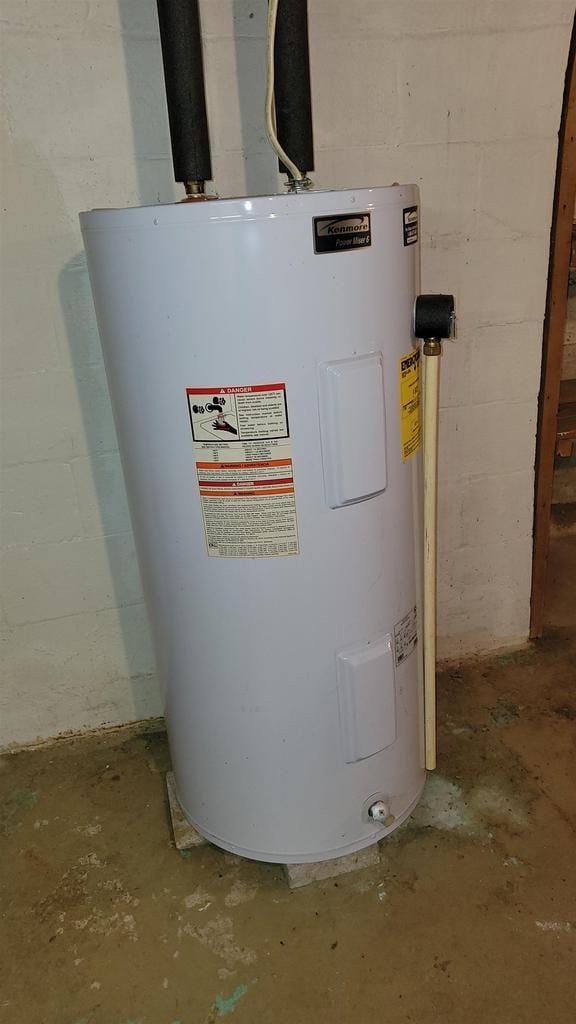 utility room with electric water heater