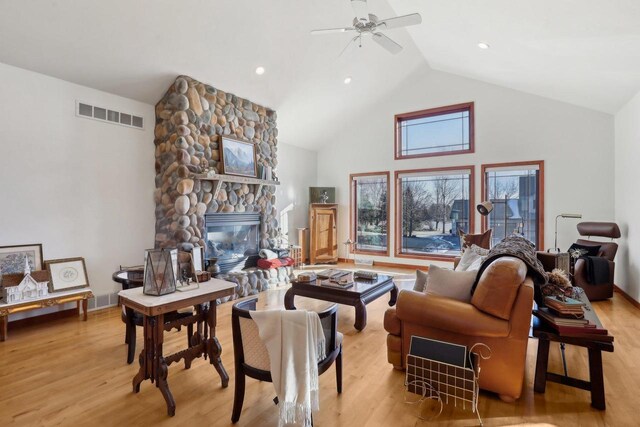 2743 Brooks Ridge Dr, Sun Prairie, WI 53590 - living room with ceiling fan, high vaulted ceiling, a fireplace, and light hardwood / wood-style floors