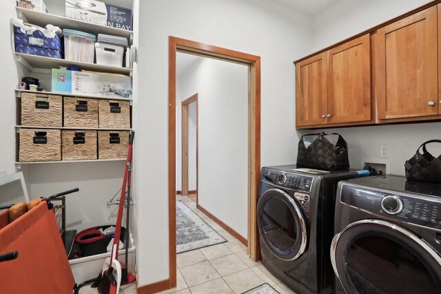 2743 Brooks Ridge Dr, Sun Prairie, WI 53590 - laundry room featuring cabinets, light tile patterned flooring, and washing machine and clothes dryer