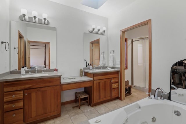 2743 Brooks Ridge Dr, Sun Prairie, WI 53590 - bathroom featuring a relaxing tiled tub, vanity, a skylight, and tile patterned flooring