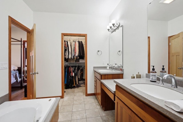 2743 Brooks Ridge Dr, Sun Prairie, WI 53590 - bathroom featuring tile patterned flooring, vanity, and a bathing tub