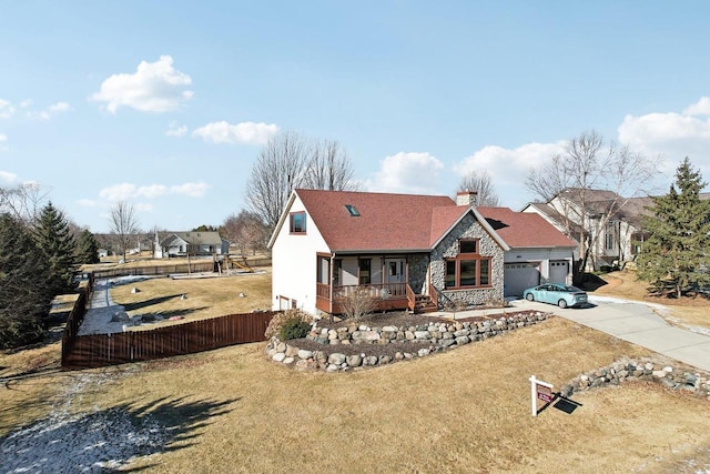 2743 Brooks Ridge Dr, Sun Prairie, WI 53590 - view of front of property with a garage, a front lawn, and a porch