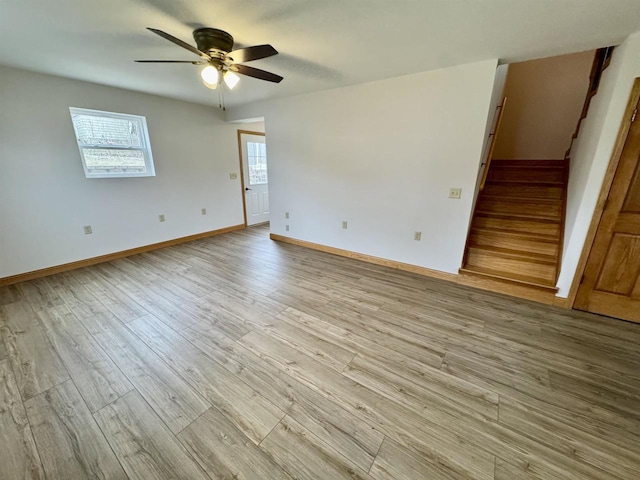 empty room featuring ceiling fan and light wood-type flooring