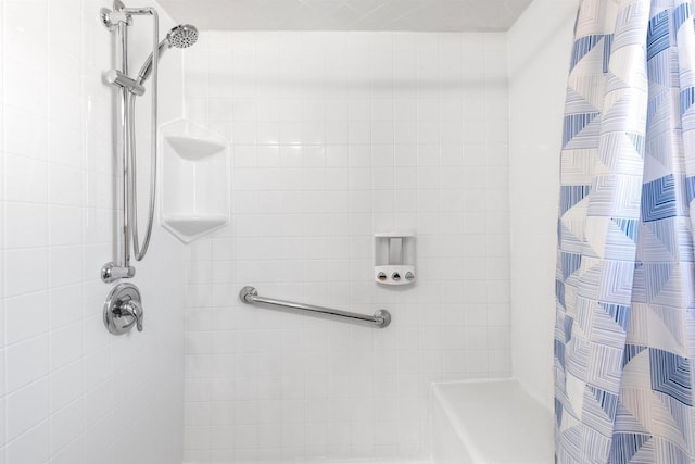 bathroom featuring a shower with curtain