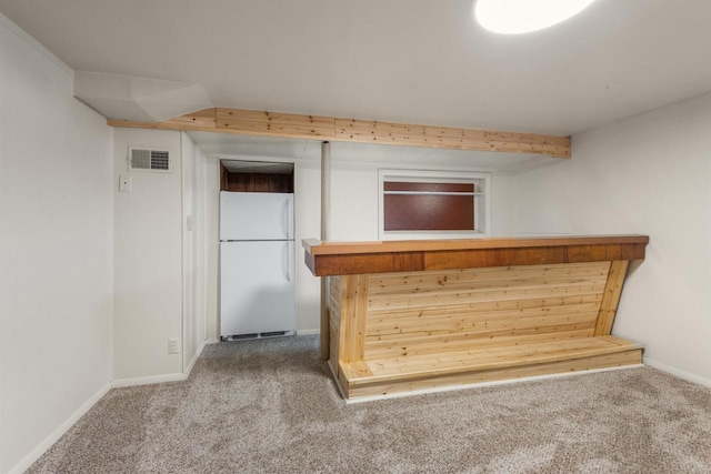 bar featuring white refrigerator and carpet floors