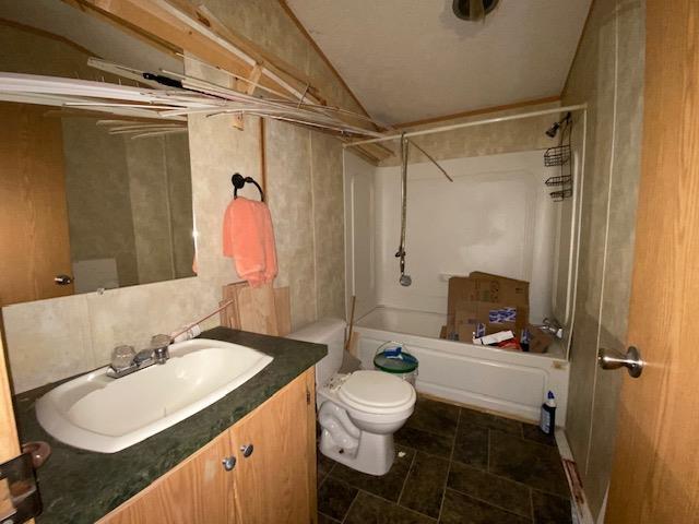 full bathroom with shower / bathing tub combination, vanity, and toilet