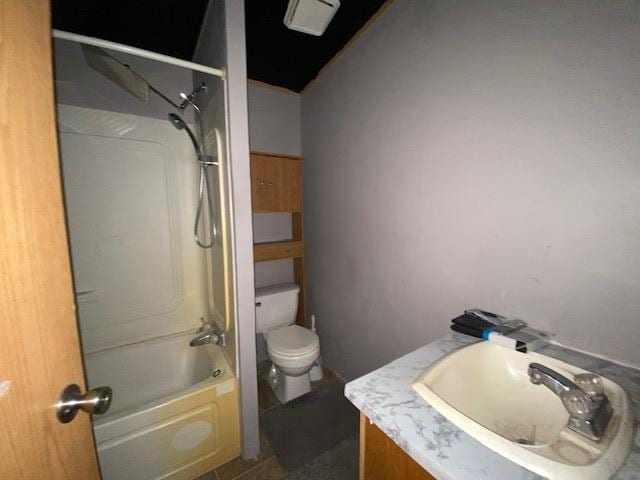 full bathroom with tile patterned flooring, vanity,  shower combination, and toilet