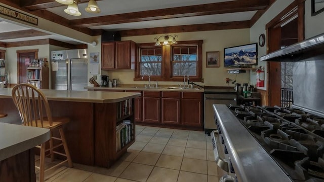 N3684 Claire Rd, Taylor, WI 54659 - kitchen with a center island, appliances with stainless steel finishes, sink, and beam ceiling