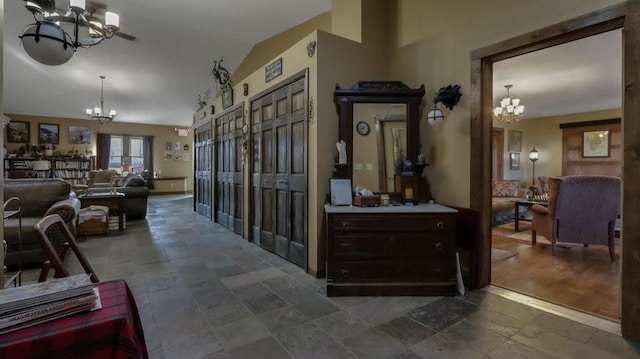 N3684 Claire Rd, Taylor, WI 54659 - hall featuring lofted ceiling and a chandelier