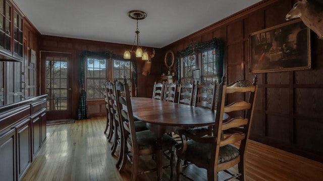 N3684 Claire Rd, Taylor, WI 54659 - dining room with a notable chandelier, wood-type flooring, and wooden walls