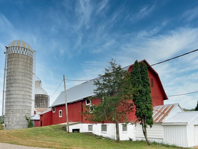 N3684 Claire Rd, Taylor, WI 54659 - view of side of property with an outbuilding and a yard