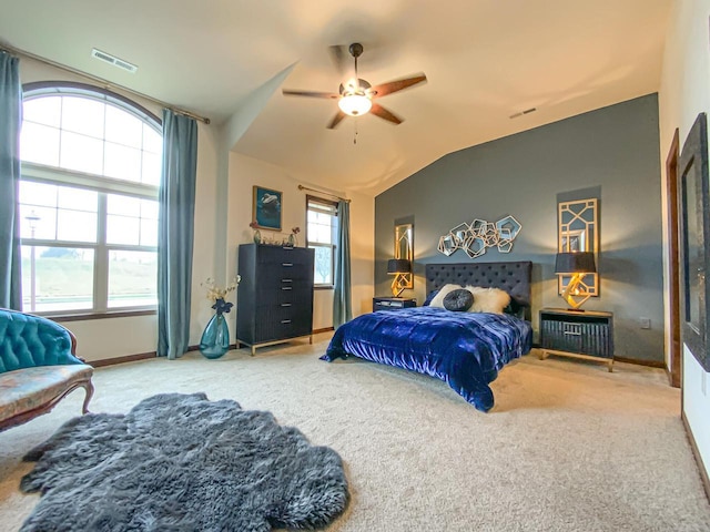 bedroom with ceiling fan, lofted ceiling, carpet floors, and multiple windows