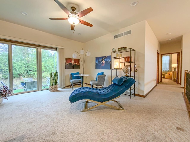 sitting room with light carpet and ceiling fan