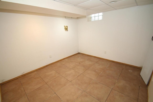 basement featuring a drop ceiling