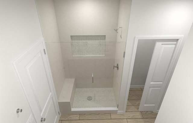 bathroom featuring tiled shower