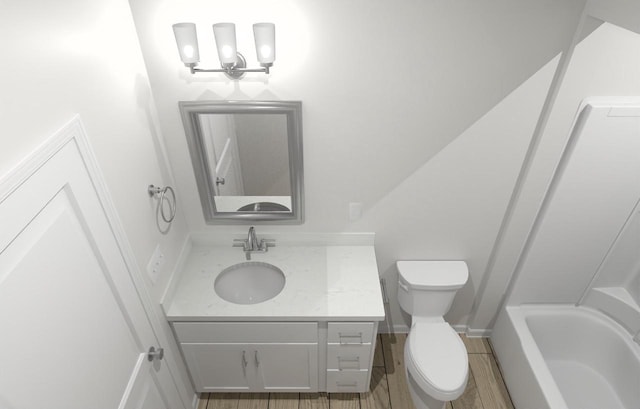 bathroom featuring vanity, toilet, and a bathing tub