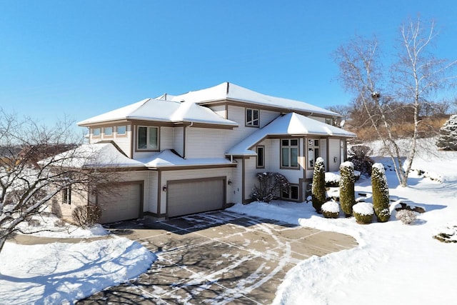 view of front facade featuring driveway and an attached garage