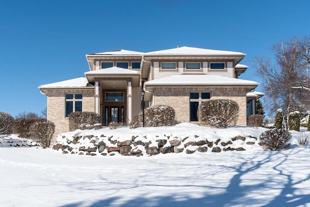 prairie-style house with brick siding