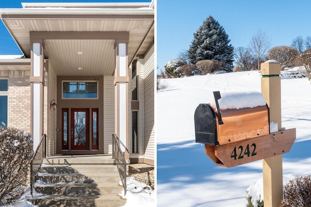 view of snow covered property entrance