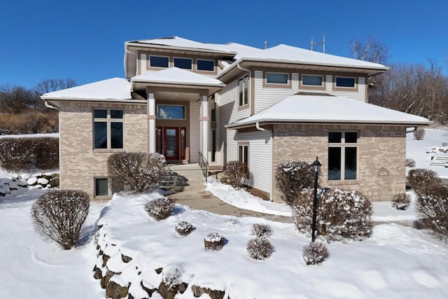 prairie-style house with brick siding