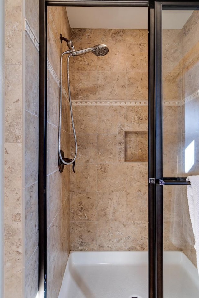 bathroom featuring a stall shower