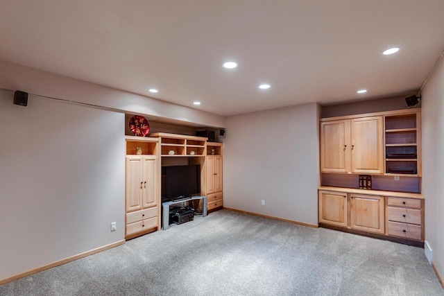 unfurnished living room featuring light carpet, baseboards, and recessed lighting