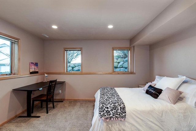 carpeted bedroom featuring recessed lighting, visible vents, and baseboards