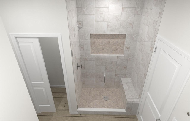 bathroom featuring a tile shower