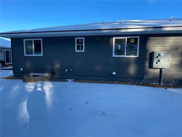 view of snow covered house