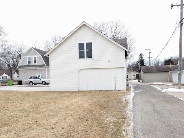 view of property exterior with a yard