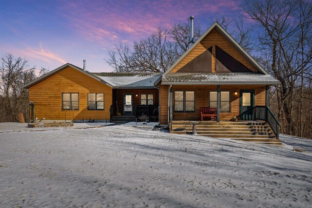 1726 Wynn Wood Ln, Harpers Ferry, IA 52146 - view of front facade with a porch