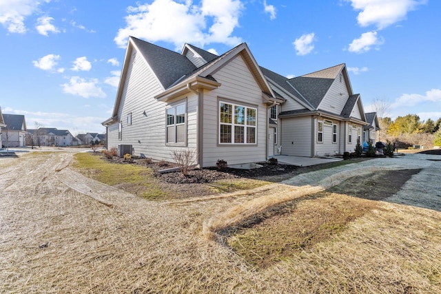 view of side of home featuring central AC and a patio