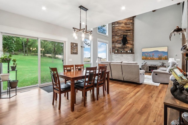 dining space featuring plenty of natural light, a chandelier, and light wood-type flooring