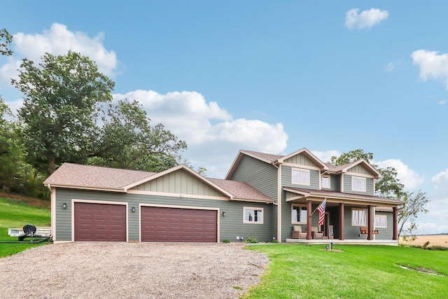 craftsman house featuring a garage, covered porch, and a front yard