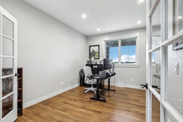 office space featuring wood-type flooring and french doors