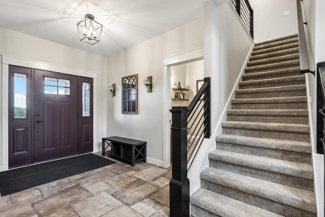 foyer featuring a notable chandelier