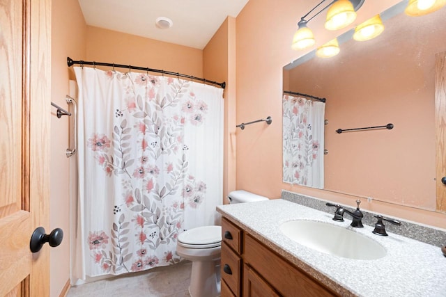 bathroom with vanity, a shower with shower curtain, tile patterned floors, and toilet