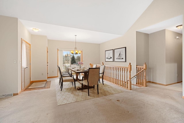 carpeted dining space featuring an inviting chandelier and vaulted ceiling