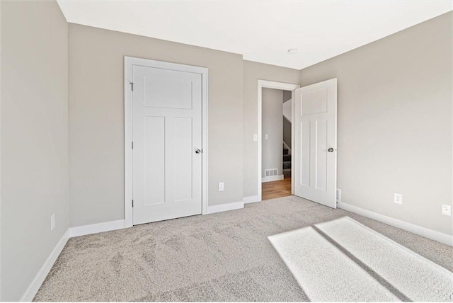 unfurnished bedroom featuring carpet floors