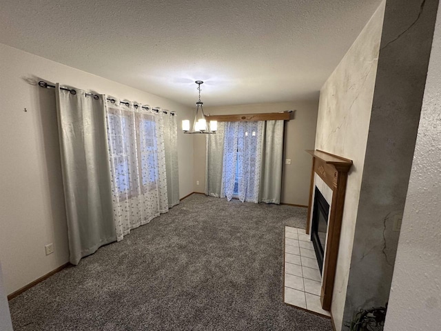 unfurnished dining area featuring light colored carpet, a chandelier, and a textured ceiling