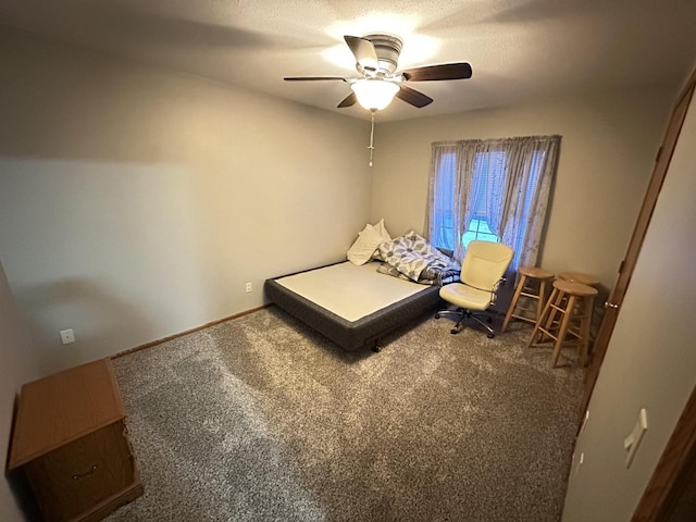 unfurnished bedroom featuring ceiling fan and carpet flooring