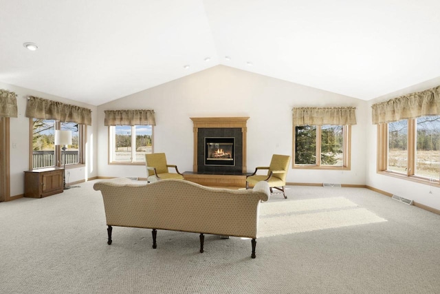 living room featuring lofted ceiling and light carpet