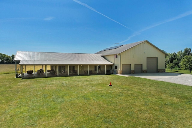 view of front of house with a garage and a front yard