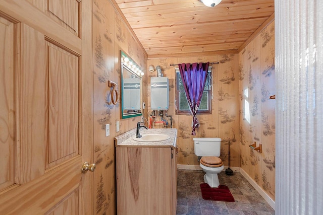 bathroom with vanity, tankless water heater, wood ceiling, and toilet