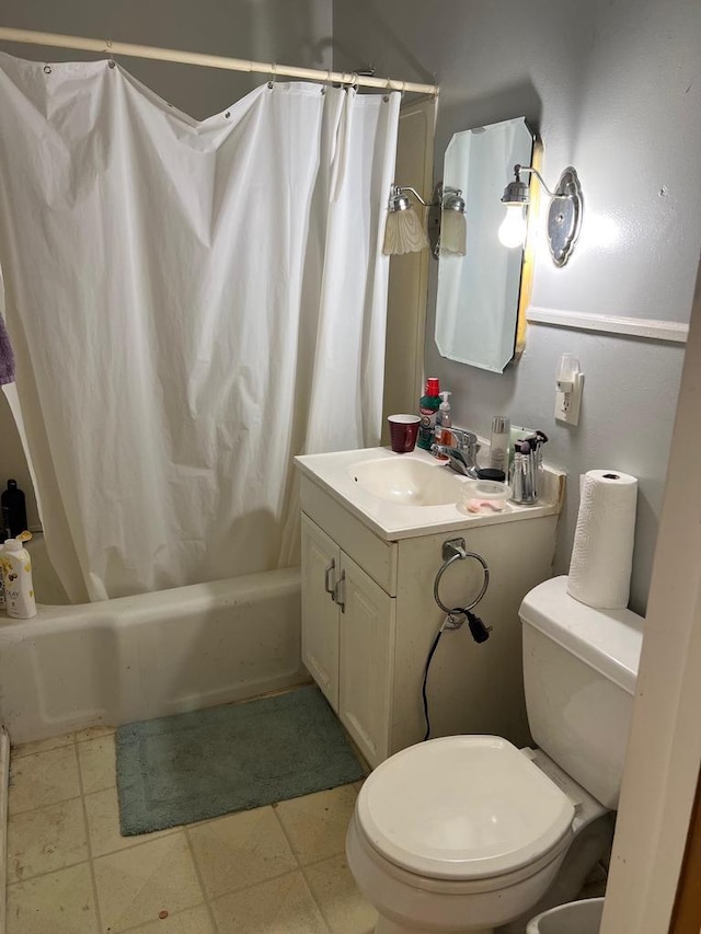 full bathroom featuring toilet, vanity, and shower / bathtub combination with curtain