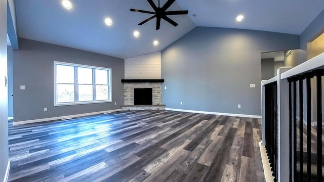 unfurnished living room featuring ceiling fan, a fireplace, dark hardwood / wood-style floors, and high vaulted ceiling